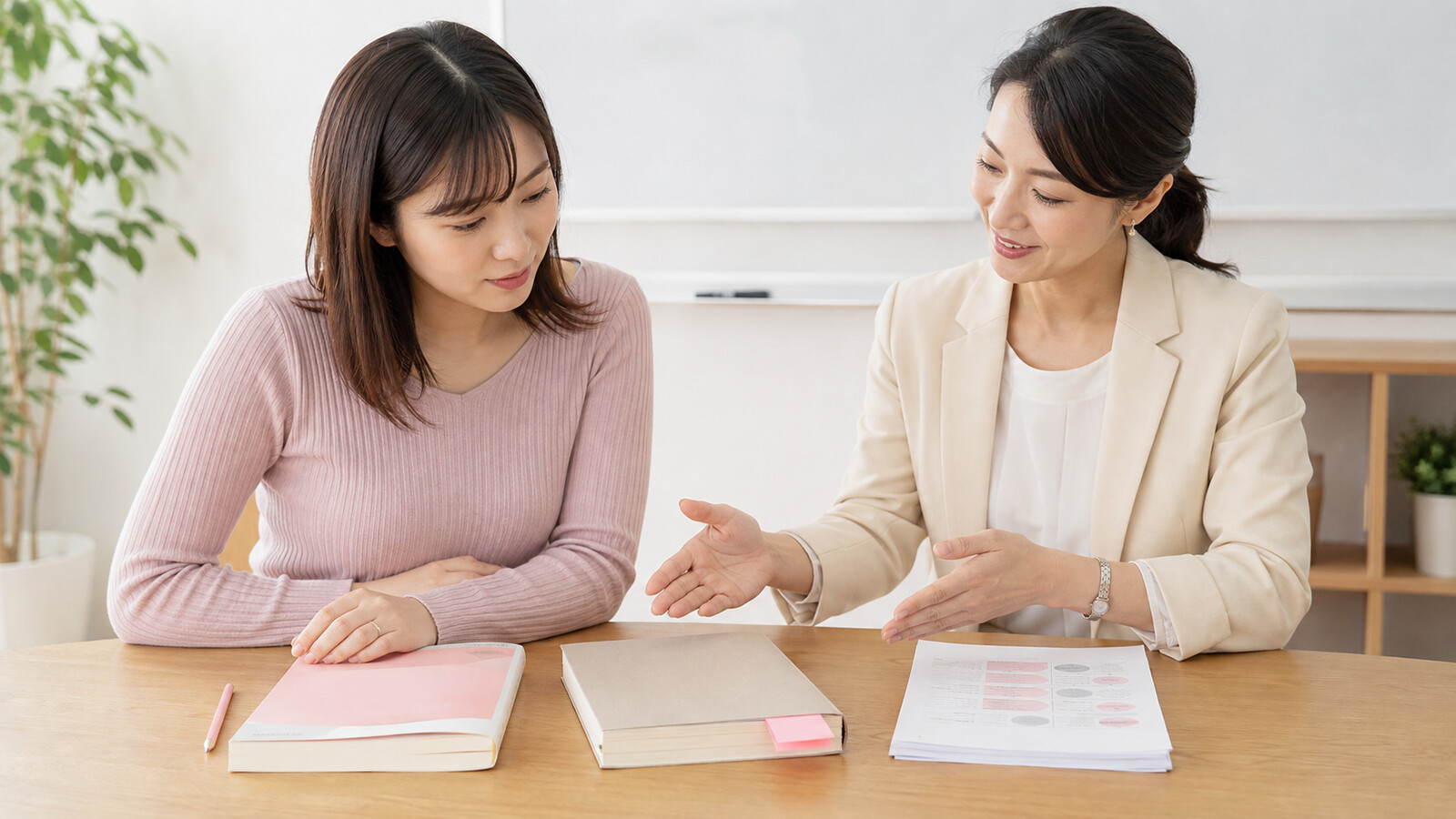 購入教材と貸出教材とプリントへの書き込み方を講師と確認する場面